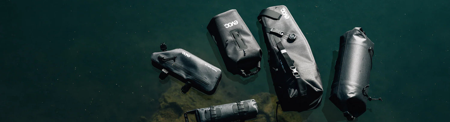Cyclists riding with bike bags on their backs