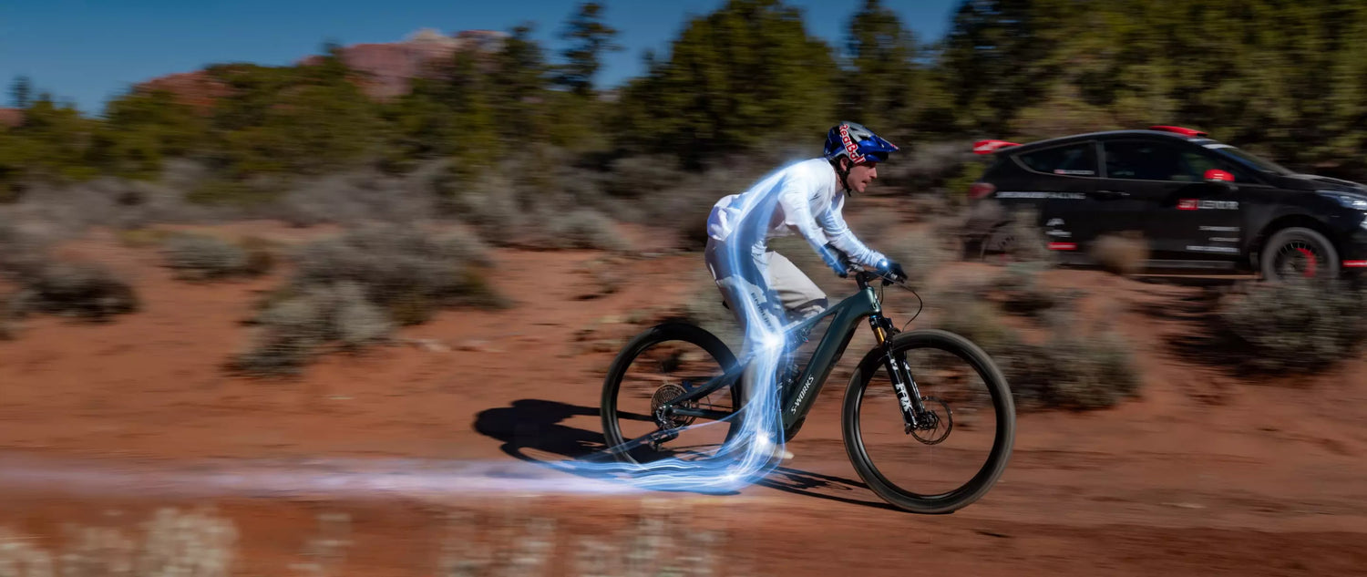 Rider using an electric bike on an open road, showcasing smooth pedal-assisted speed and powerful performance